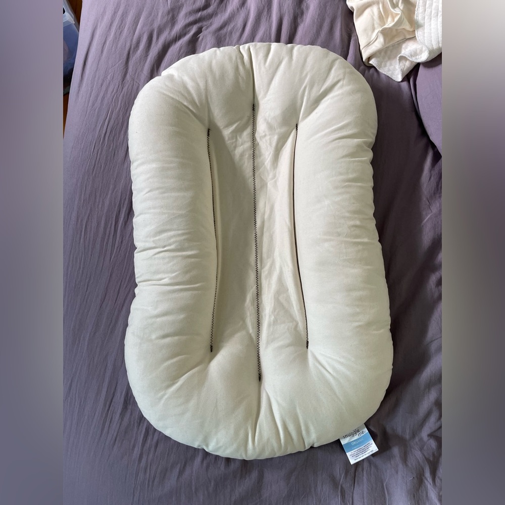 Snuggle me organic infant lounger with 2 covers and a puddle pad